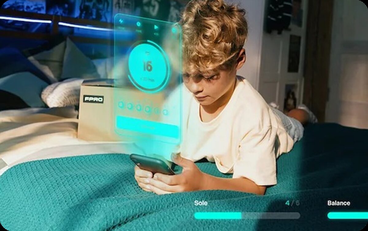 Child following an FPRO training session on the app at home